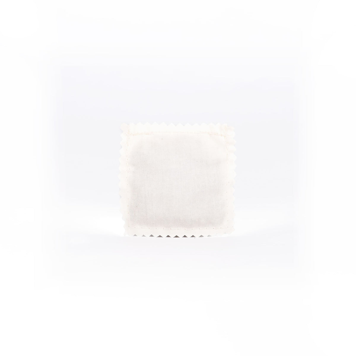 Organic sachet filled with organic catnip on a white background